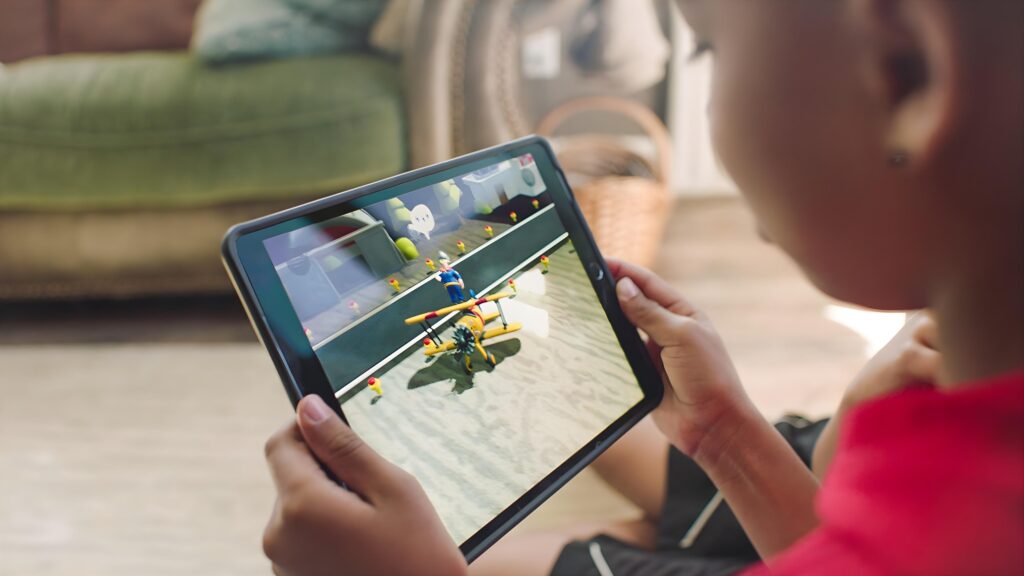 kid playing A Brief History of Amazing Stunts on an iPad